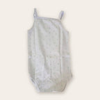 Strappy Printed Baby Bodysuit – White / Footsteps – front, styled