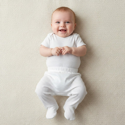 Baby wearing white footed pants, 100% cotton