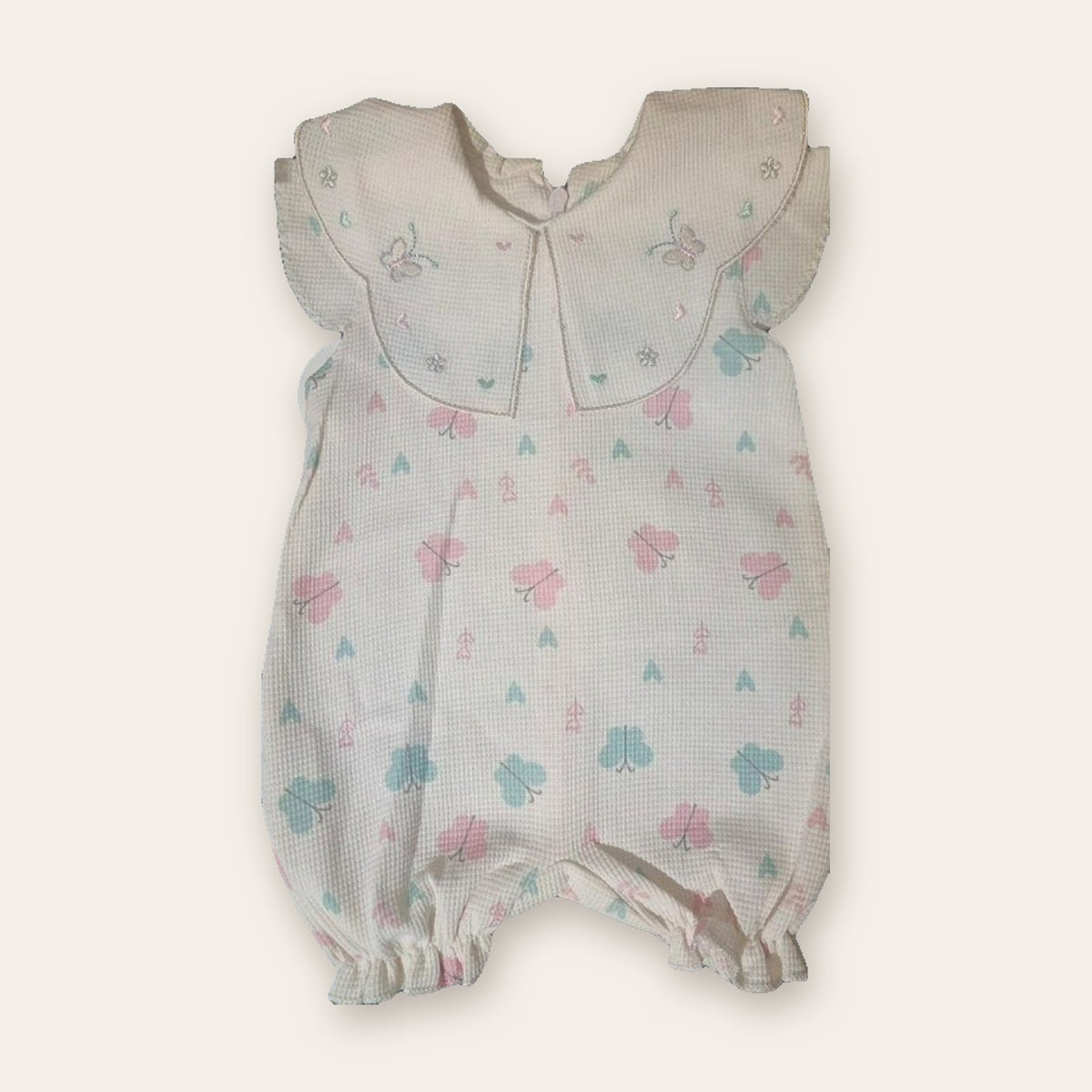 Flutter-Sleeve Waffle Baby Romper – White / Butterflies – front, styled