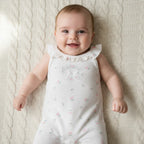 Baby wearing flutter-sleeve waffle romper, tulip print